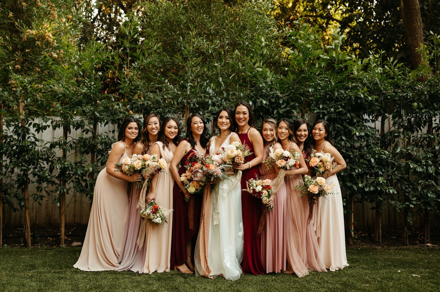 bridesmaids in blush mixed dresses