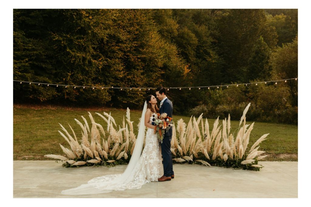 under canvas smoky mountains festival fall wedding ceremony with pampas grass