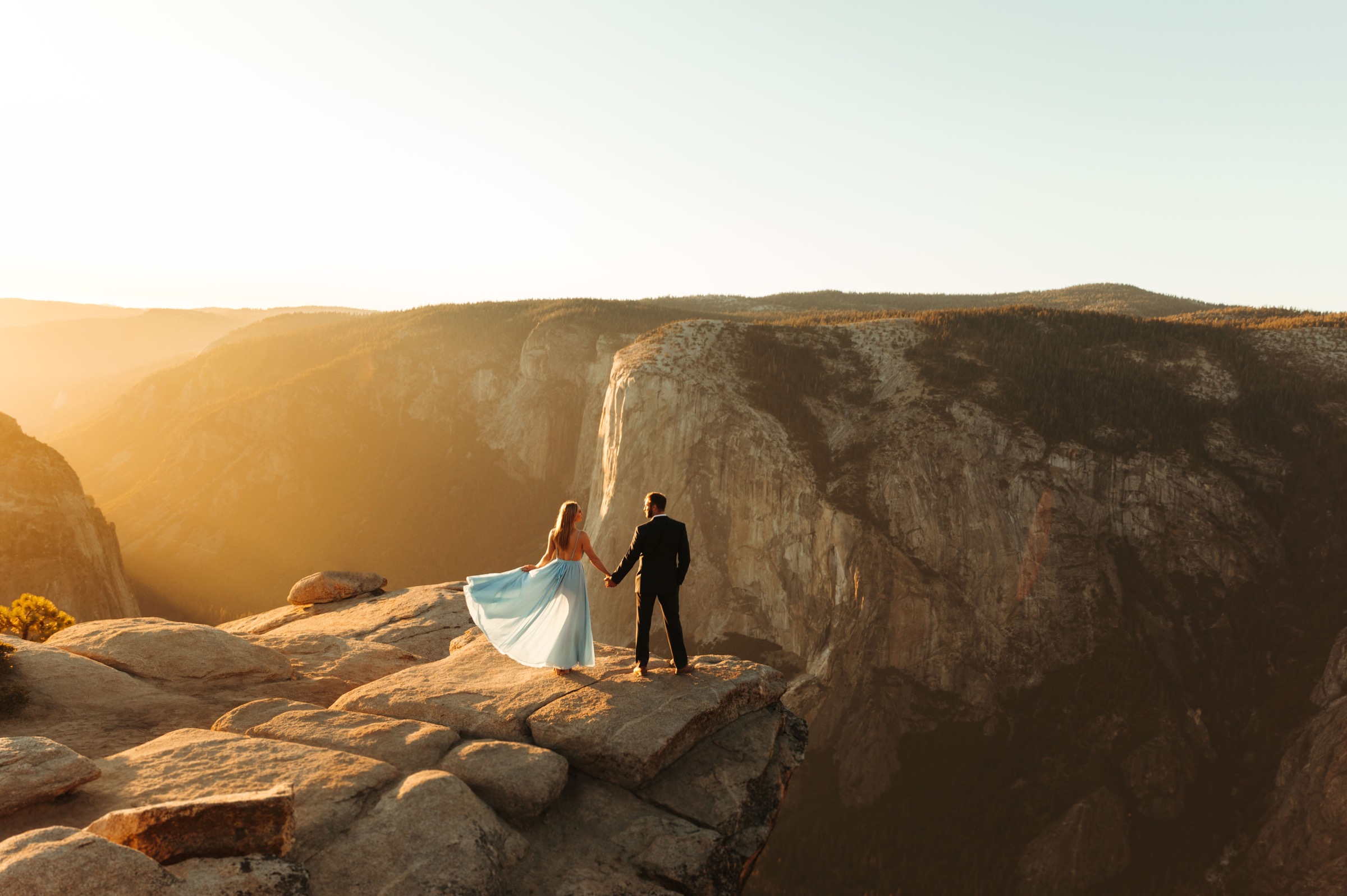 yosemite engagement session at taft point blue flowy dress and suit
