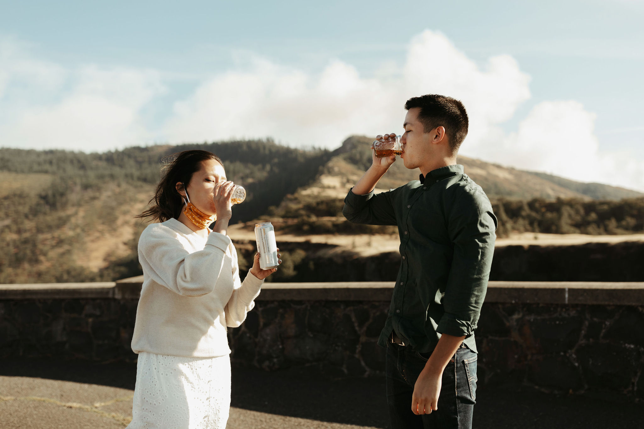 couple taking shots before engagement session