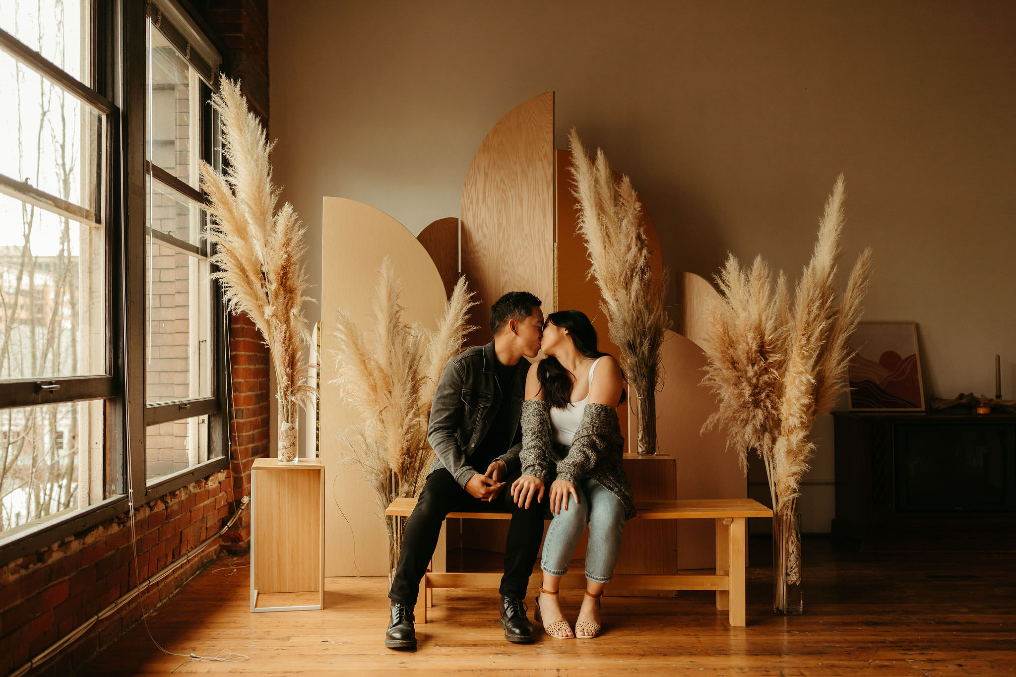 couple in seattle studio for modern pampas grass engagement session