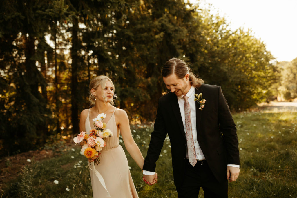 nontraditional bride and groom walking together