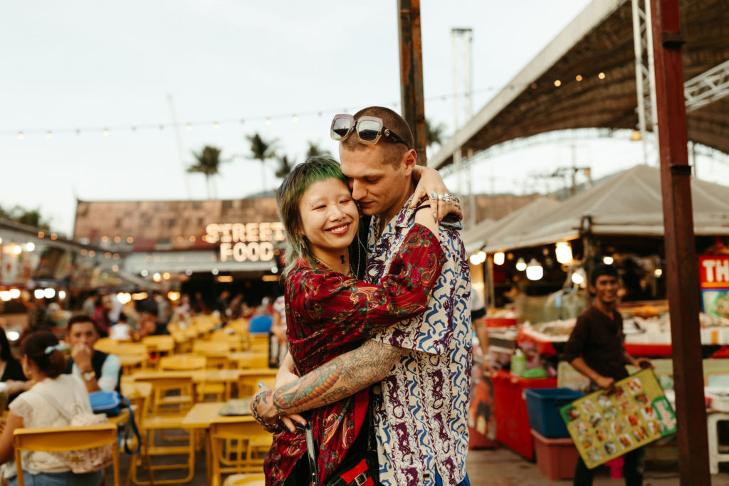 couple hugging at the patong beach street food night market