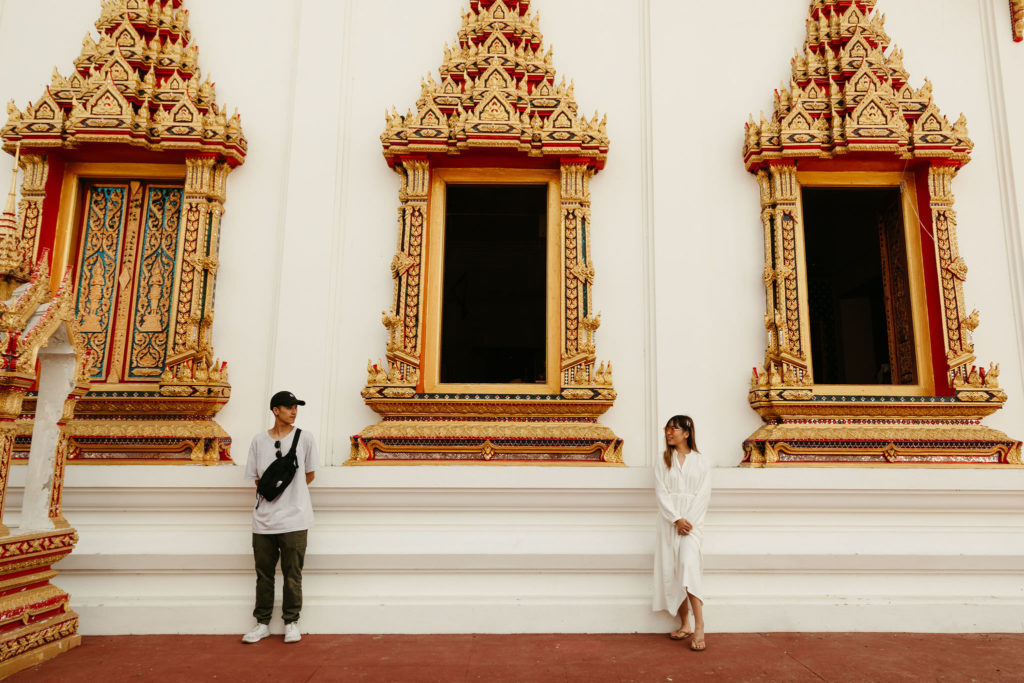 couple at the temples in phuket thailand