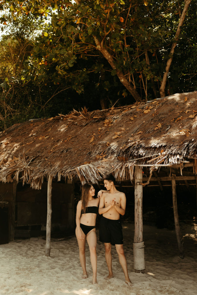 couple in black swim suits at phi phi islands of thailand